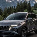 2027 Hyundai Tucson Hybrid refined center console physical climate buttons and AWD specs